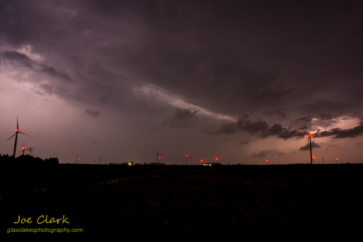 Lightning storm in a wind farm by Joe Clark.